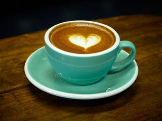 Coffee cup latte art in cafe.