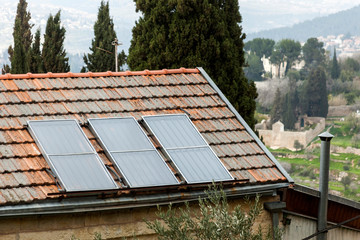 Solar panels on the roof of a small house