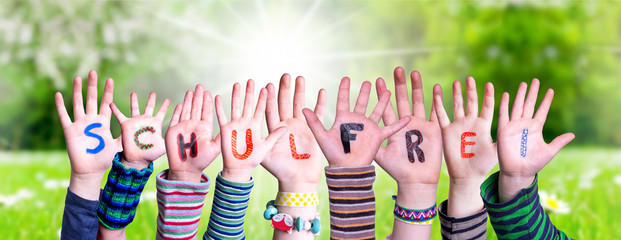 Children Hands Building Colorful German Word Schulfrei Means School Holidays. Green Grass Meadow As...