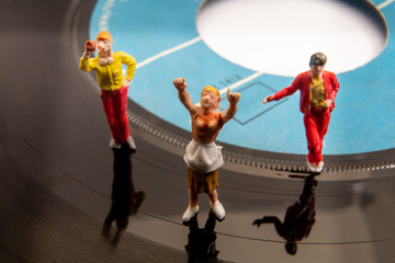 Miniature People having a Party on a Vinyl Record