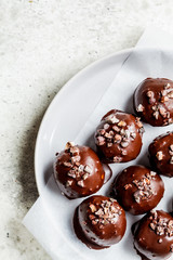 Vegan Chocolate Truffle Balls on gray plate.