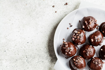 Vegan Chocolate Truffles Balls on gray plate.