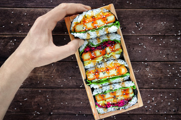 Vegan Japanese sushi sandwiches (onigirazu) with tofu and vegetables