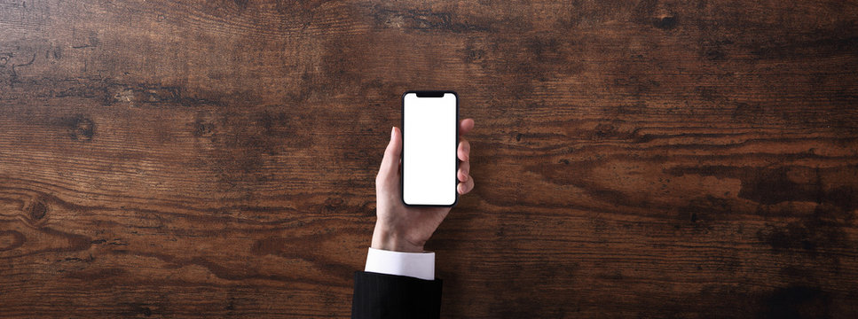 スマホを持つビジネスマン - Powered by Adobe