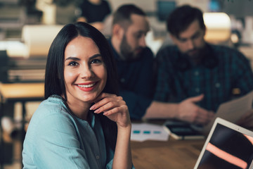 Beautiful smile of happy young woman at work stock photo
