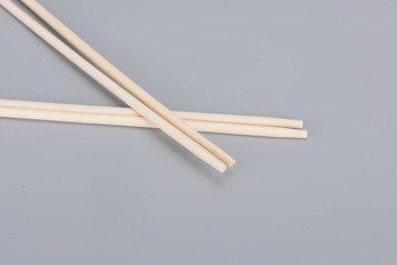 Disposable chopsticks in gray background