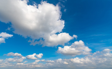 Naklejka na ściany i meble A blue sky with white clouds