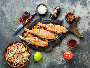 Fried fish with horseradish roots