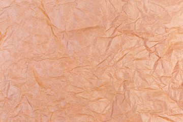 Background of brown crumpled wrapping paper, fragment close-up, texture