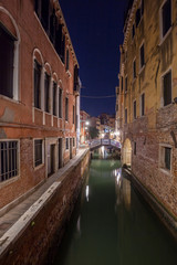 Plakat Narrow canal with boats and vintage houses at dusk. Venice city at night