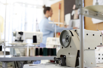 Modern sewing equipment in tailor workshop
