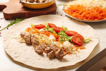 Tasty doner kebab on table