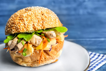 Tasty doner kebab in bun on plate