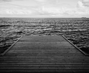 Obraz premium monochrome wooden pier on the sea. minimalism