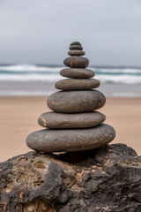 Fototapeta na wymiar Stone Tower At A Portuguese Beach