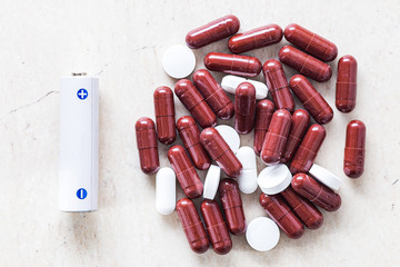 Battery and white pill medicine, energy for life, ideaBattery and capsules and tablets. energy...