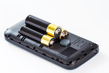 AA batteries do not fit into phone. energy shortage concept
