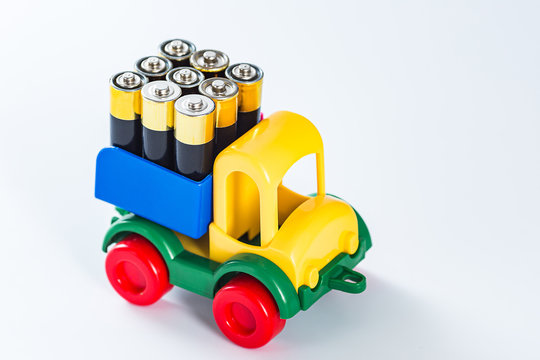 Toy truck with full body of AA batteries. energy need concept. electric truck