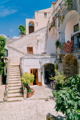View of the courtyard of an old colorful Italian house on a sunny day.