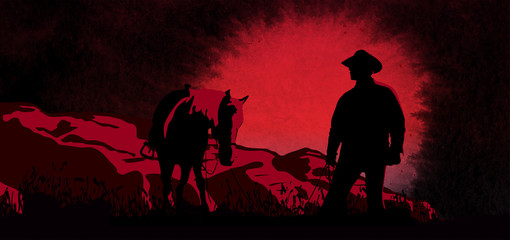 Cowboy on horse ride on sunset. Mountains on the horizon