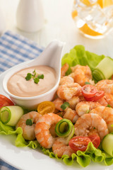 Grilled shrimp salad with fresh lettuce, cherry tomatoes and creamy sauce.