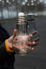 Hand catching a light bulb. Light bulb concept.