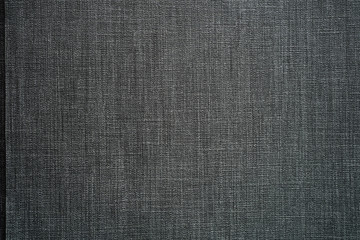Fototapeta na wymiar Textured dark gray fabric for the background 