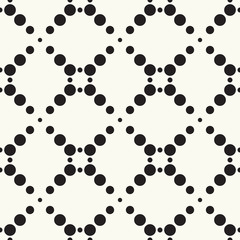 Seamless pattern halftone design. Modern textile print with black dots. Vector fashion background. Grid of circles.