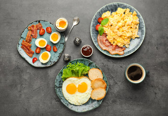 Different tasty dishes with eggs and coffee on table