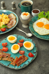 Different tasty dishes with eggs on table