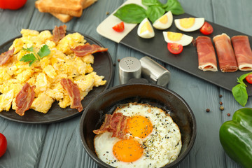 Different tasty dishes with eggs on table