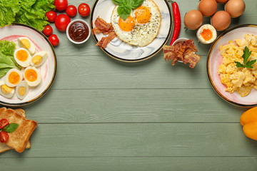 Different tasty dishes with eggs on table
