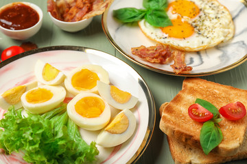 Different tasty dishes with eggs on table