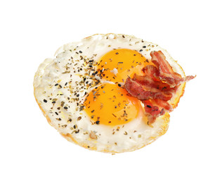 Tasty fried eggs with bacon on white background
