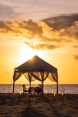 Dinner table at the beach at sunset