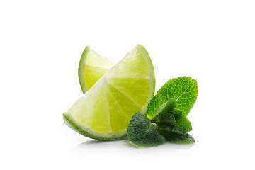 Fresh lime. Slices of ripe and juicy lime with green mint leaves close-up © al1974ex