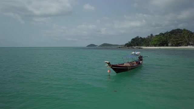 Koh Samui Drone scenes - Longtail Fishing Boats - circeling a long boat off the coast