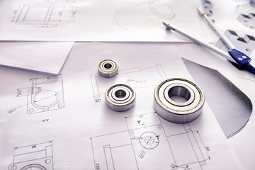Bearings and drawings on table of engineer