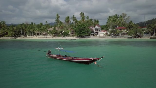 Koh Samui Drone scenes - Longtail Fishing Boats 2 - circeling over a long tail boat off the coast of Koh Samui Island