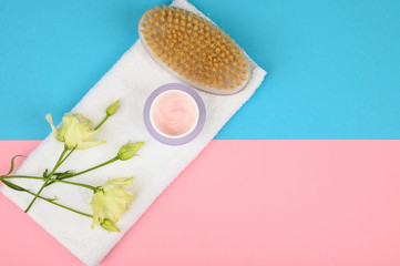 white towel and freshness. on a pink-blue background. open and closed buds, place for an inscription. flat lay.