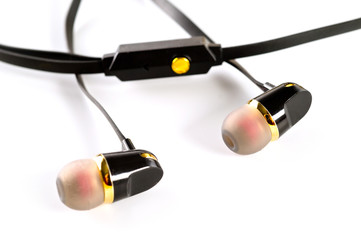 Vacuum headphones in black with a headset, shot on a white background. Background for music and...