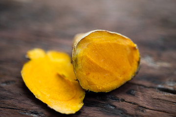 Fresh turmeric on wood table.