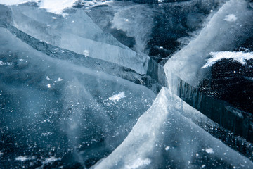 Naklejka na ściany i meble Methane Bubbles in the Baikal Ice.ice and cracks on the surface of Lake Baikal, Winter.Top view. Winter texture.Air bubbles in ice.Baikal ice. Crystal clear drinking water. 