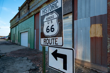 An historic Kansas US route 66 road sign in the State of Kansas, USA; Concept for travel in the route 66 and road trip in the USA - Powered by Adobe