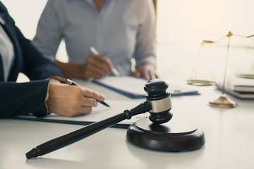 Woman judge is currently advising clients on their requests for legal proceedings and legal advice.