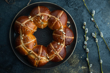 Easter cake and egg for the holiday. Homemade hot cross buns on Easter table.