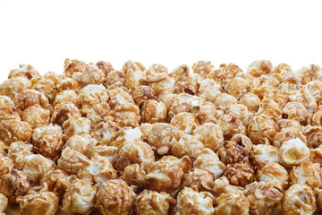 Heap of delicious caramel popcorn, isolated on white background . Scattered popcorn texture background.
