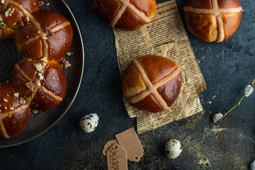 Traditional Easter cross buns on easter background.