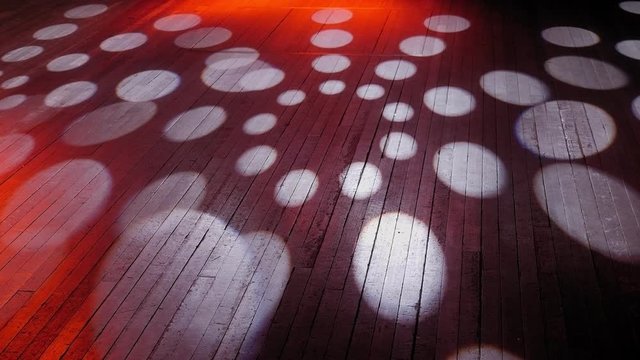 Concert wooden stage with white rays on the floor. Concert lighting on an empty stage, circles of light on the floor.