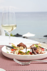 Delicious meal served on the balcony with sea view.